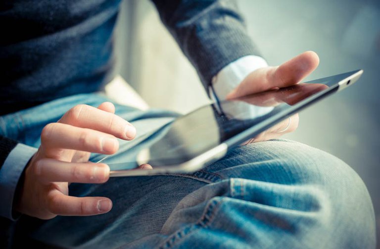 Man looking at tablet computer