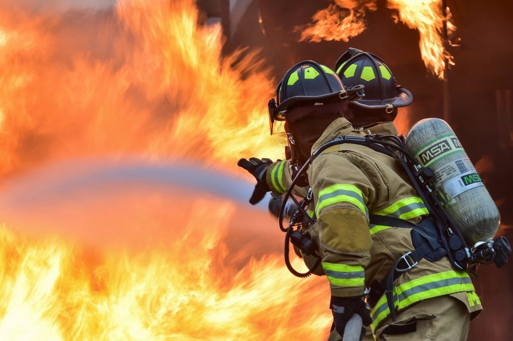 Two firefighters fighting blaze