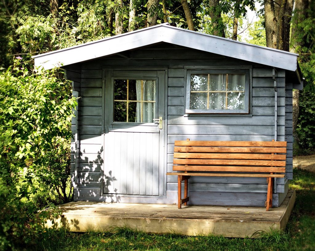 Wooden country cabin with bench