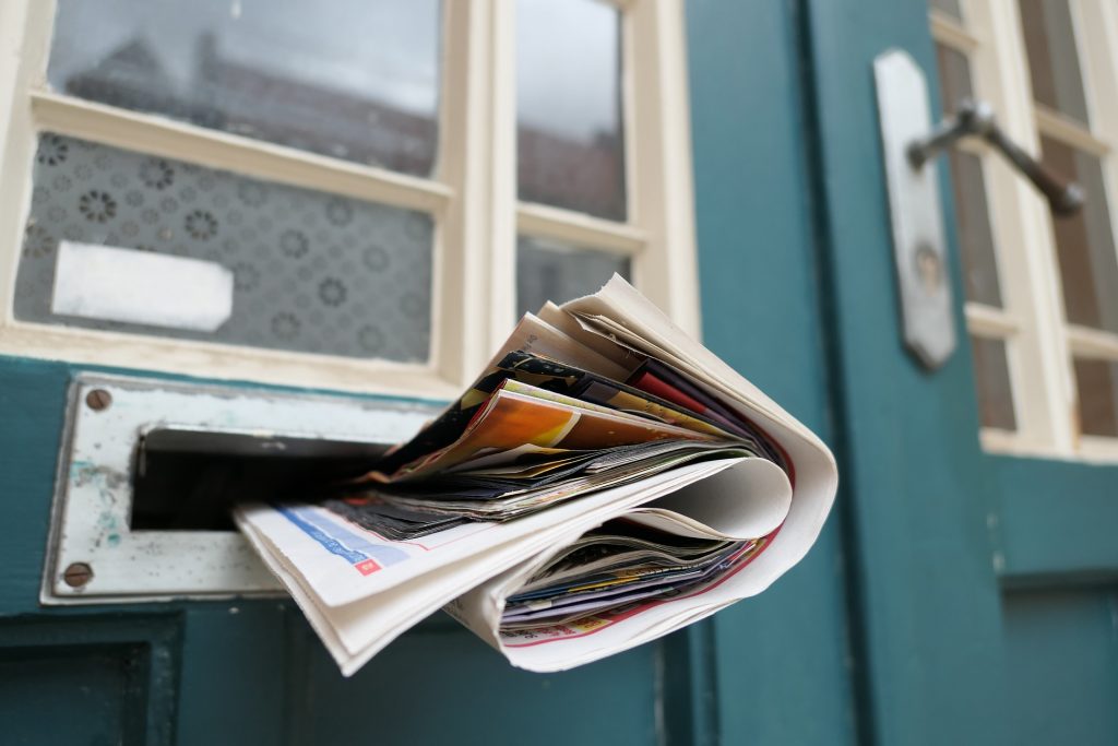 Newspaper sticking out of letterbox