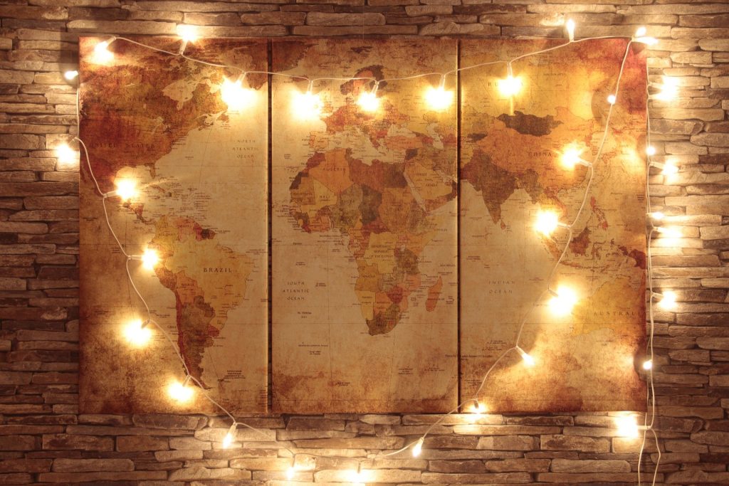 Map of world covered in fairy lights