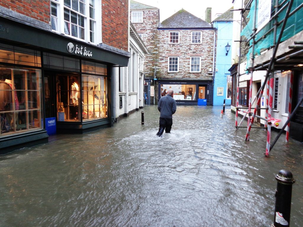 Man wading through flooded street