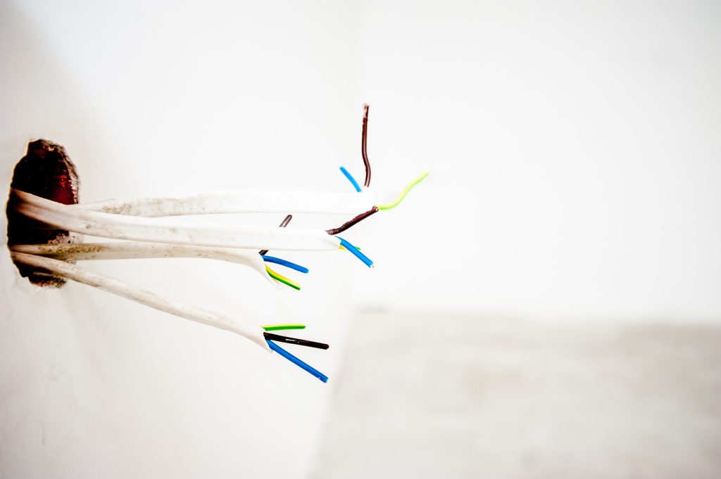 Exposed wires coming out of wall