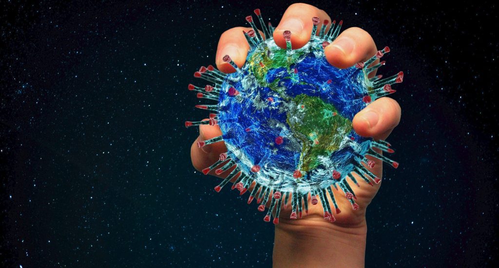 Earth as a virus held in a hand