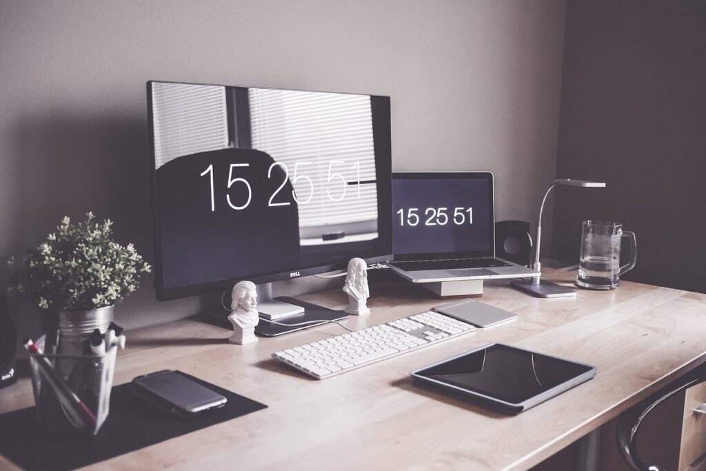 A modern looking desk with a monitor on it